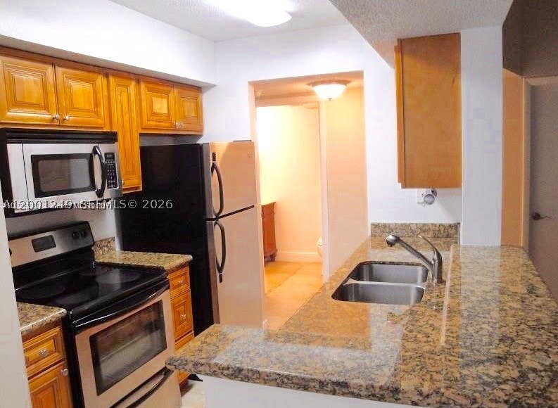 Photo of 5760 Rock Island Rd #340, Tamarac, FL 33319 (MLS # A12001249)