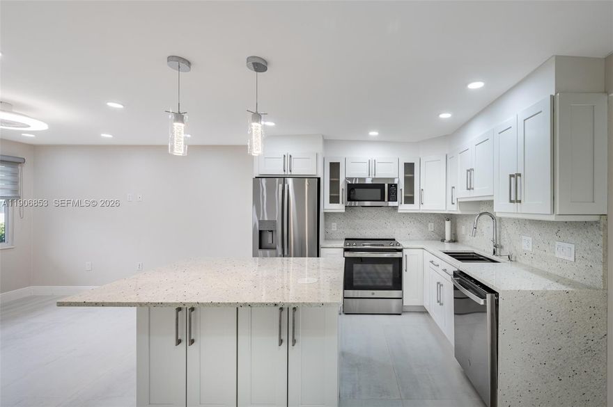 A rare gem in a vibrant 55+ community! This one-of-a-kind one bedroom, first floor apartment is now available for sale. The property boasts a meticulous and comprehensive renovation, spanning from the drywall to the ceiling, showcasing impeccable attention to detail. The home features a brand-new AC system, impact-resistant windows and door, and a tankless water heater The kitchen is a true showstopper with granite countertops, stainless steel appliances, and a center island. The bathroom has curbless shower and shower tower. The extended bedroom features a custom closet system, zebra shades blinds. Plenty of storage, built in pantry, remote fans and much more! 
Welcome to Century Village, Deerfield Beach’s Active 55+ adults gated community. Features: clubhouse, with indoor & outdoor pools, live shows, fitness center, tennis courts, shuffleboard, volleyball, bocca ball, pickle ball. Convenient in-house bus transportation to local malls, shopping centers and medical facilities. Close to the Beach, restaurants, and shops.