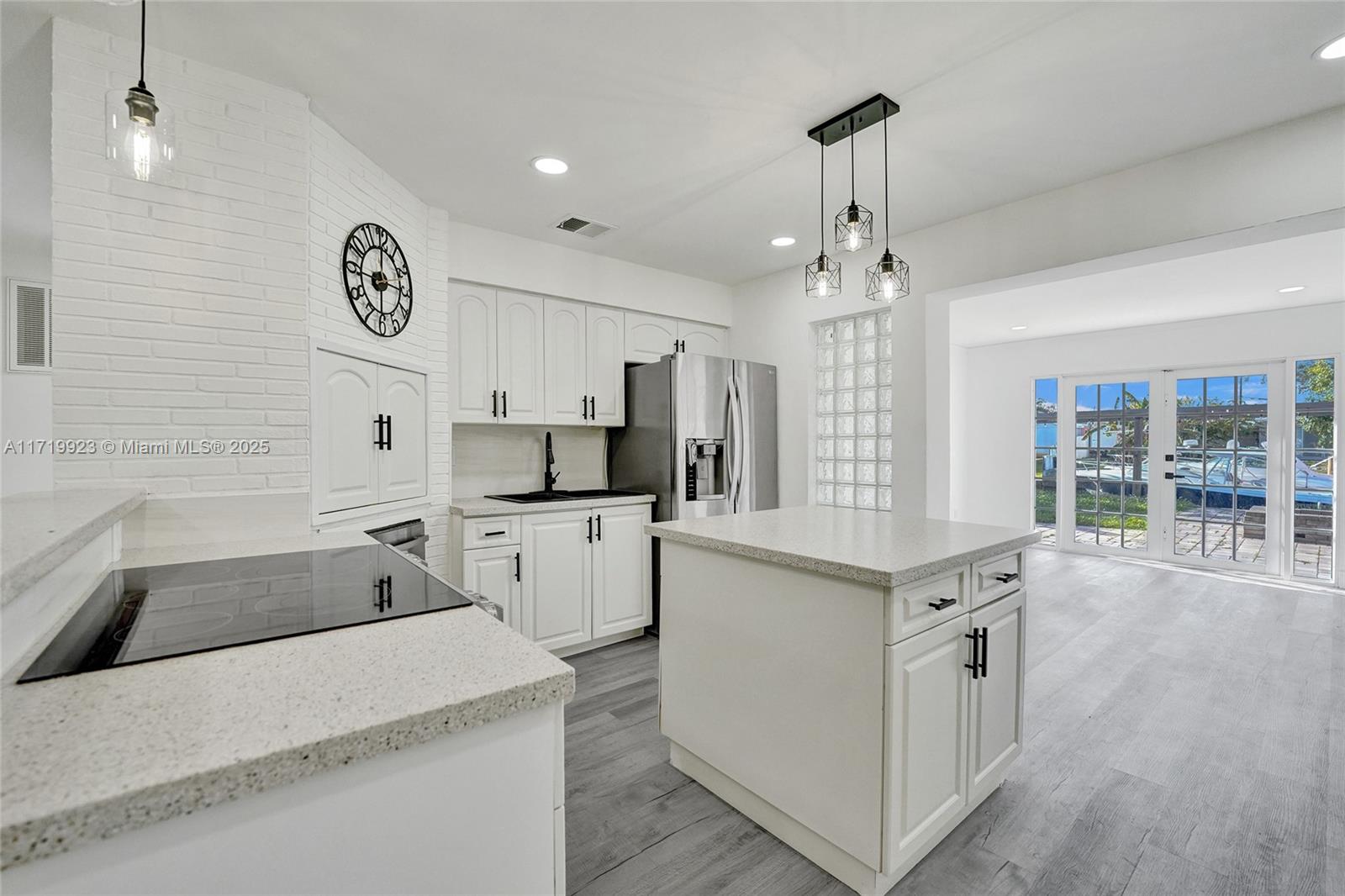 Waterfront perfection with seller financing available! This beautifully renovated home offers canal views, direct ocean access, a 60ft concrete dock, and an updated seawall. Featuring spacious living areas, a modern kitchen, tastefully updated bathrooms, newer appliances, one car garage and an enclosed Florida room (could be den or office) this home blends style and comfort with convenience. Major upgrades done: 2024 flat roof, 2017 tile roof, and 2015 AC. Located minutes from beaches, dining, shopping, houses of worship, and the airport. Priced below comps—don’t miss this rare opportunity! Ask about lender credits available for financed offers.