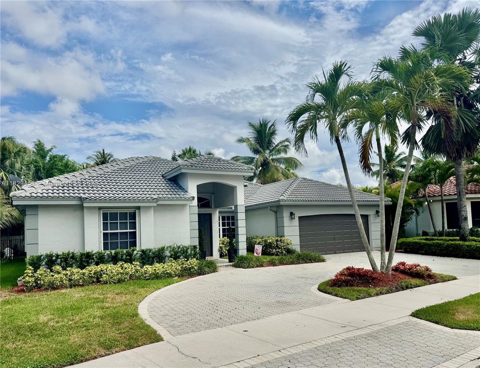 Gorgeous and highly desirable Coventing Five Model features 5 Bedrooms and 3.5 Baths. Beautiful curb appeal with a grand oversized circular driveway. Recently installed New Roof, Gourmet Kitchen to satisfy any Chef in your family, Hurricane shutters and pure privacy awaits you! Enjoy pure privacy in your backyard.