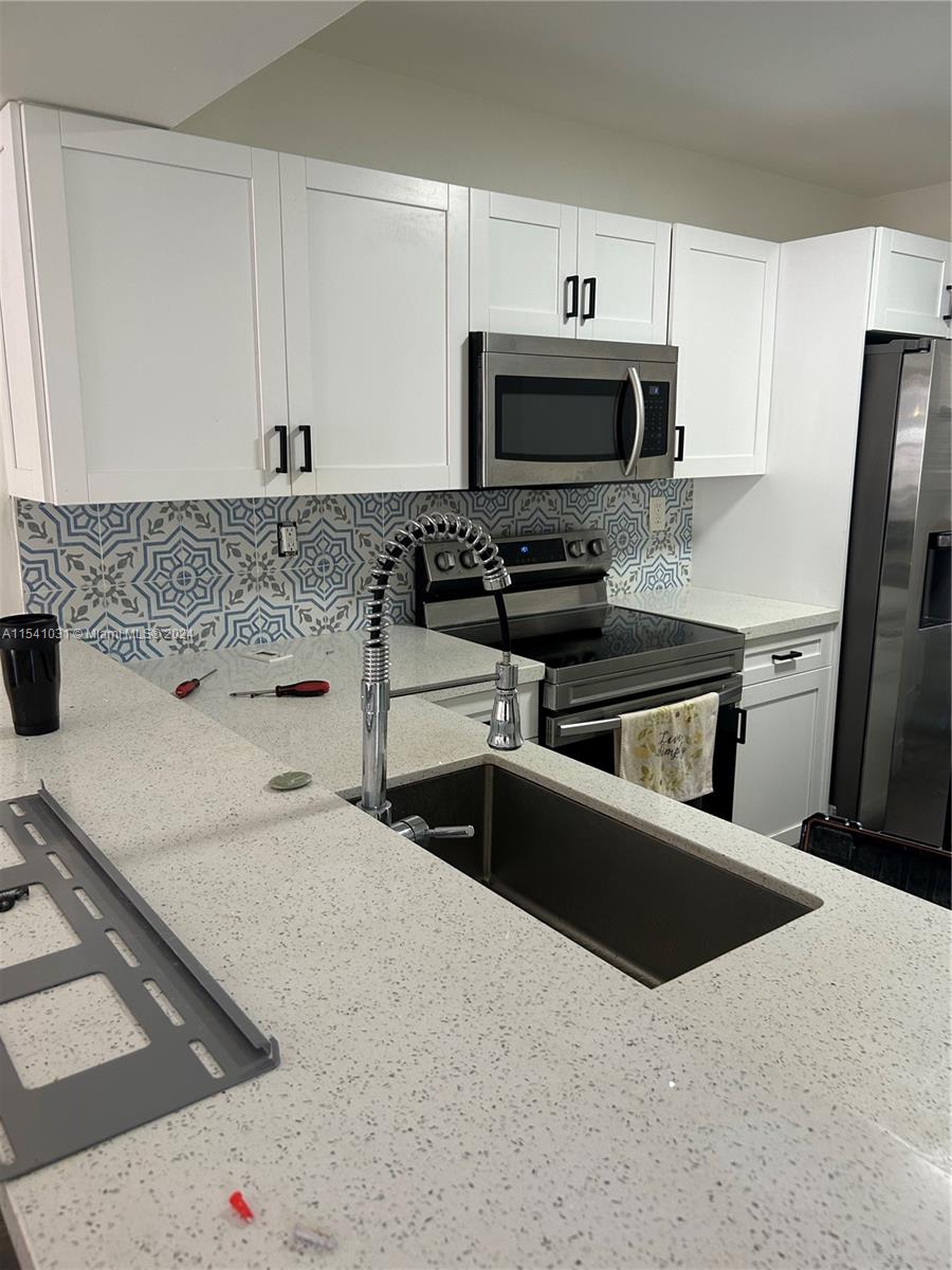 This is a rare one story corner townhouse in a gated community centrally located in Calusa. It is completely remodeled and ready to move in. it has a separate laundry room and has a beautiful exterior patio that opens up to back green area. This being one story makes it perfect for people that don't want stairs. Please reach out to listing agent for all info
