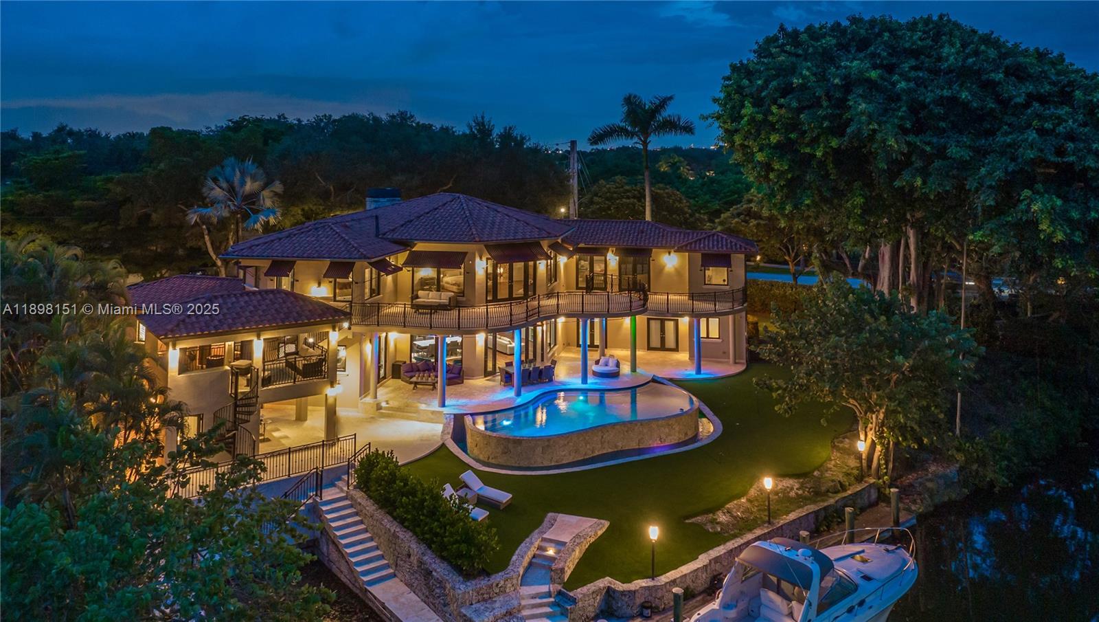 Discover an exceptional double corner lot estate on the peaceful Mahi Waterway in South Coral Gables. This boater’s paradise offers 197 feet of waterfront, a 60-foot dock and a rare grandfathered 40-foot boat slip with quick ocean access through just two high bridges. The residence features expansive living areas with tranquil water views finished in natural stone and Brazilian walnut, a gourmet kitchen with Wolf, Sub-Zero, True, and Miele appliances. Upstairs you will find two impressive master suites with a spacious loft. The spa inspired master bath includes a soaking tub and sauna. Highlights include dual gas fireplaces, a Fire Magic summer kitchen with bar and lounge, Crestron lighting, and a commercial grade audio system. Offered furnished or unfurnished, also available for lease.