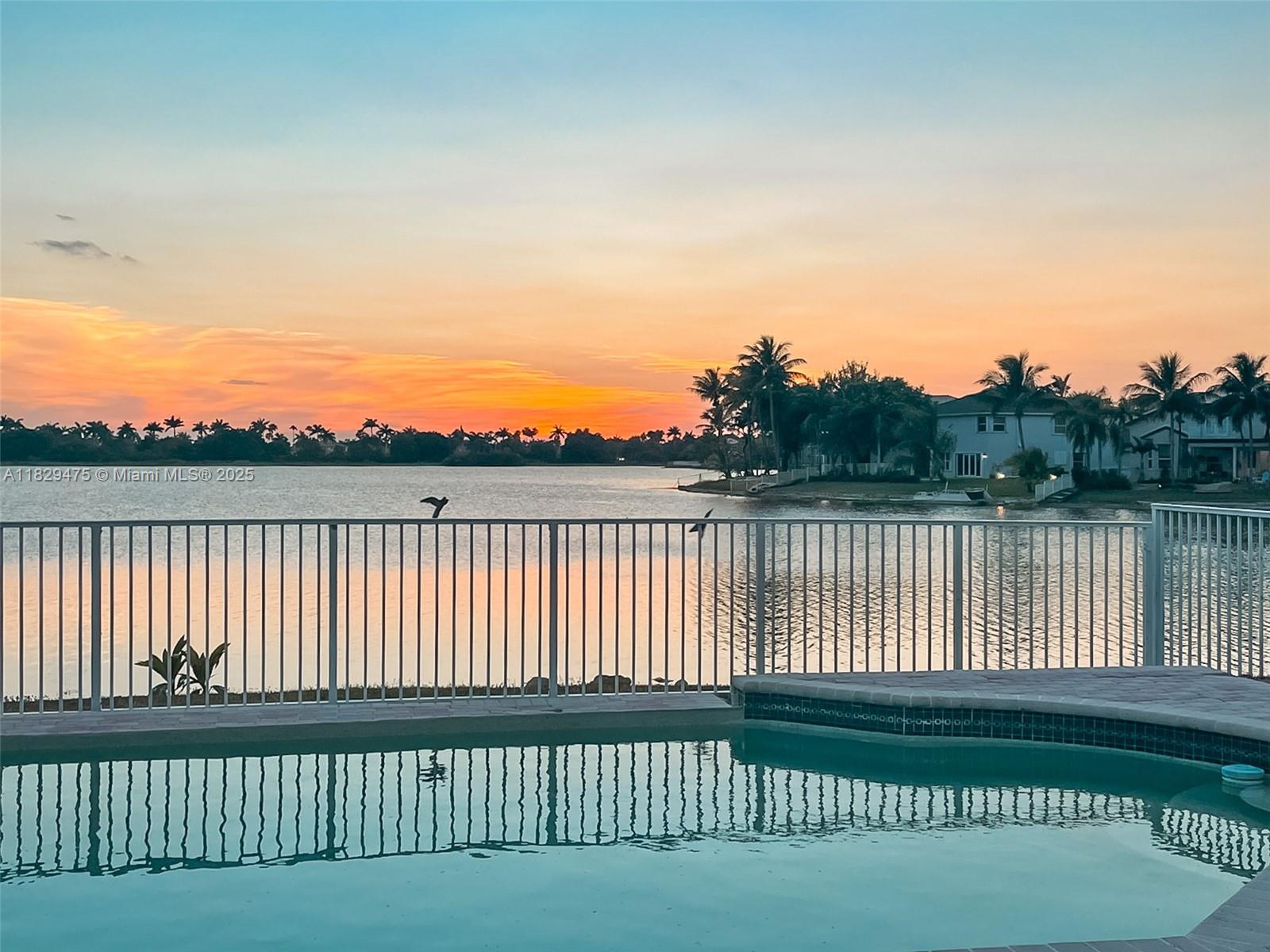 Experience lakefront living in this stunning 4-bedroom, 3-bath single-story home in the exclusive gated community of Pelican Sound in Miramar. With nearly 3,000 sq ft of living
space, this residence offers an open, airy layout with vaulted ceilings and an expansive floor plan. Enjoy serene lake views from your private fenced pool, perfect for entertaining or
unwinding. The home’s direct lakefront setting and spacious design make it ideal for both everyday comfort and weekend gatherings. A true retreat in a prime location! Vacant &
easy to show.
