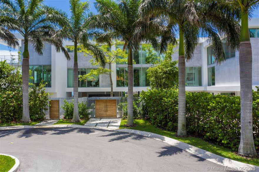 Magnificent 18,837 Sq. Ft. residence with 5 bedrooms, 5 full and 3.5 half baths, offering captivating views with 350 Ft of waterfront. Features include floor-to-ceiling impact windows and doors, elevator, media room, fitness room, and smart home technology throughout. Open-plan living spaces showcase exceptional design including a top-of-the-line Gaggeneau chef's kitchen. The main suite situated in a private wing is the ultimate hideaway, with a balcony and sleek bathroom with a glass shower and steam.  A studio with a loft and wet bar provides an additional sanctuary.  Outdoors, enjoy 2 pools including one on the rooftop with a viewing deck, alfresco dining area, and a 5-car garage.  An architectural masterpiece with extraordinary views and amenities for an unmatched living experience.