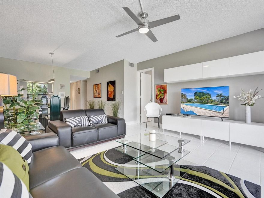 Beautiful & completely remodeled unit with new kitchen with white cabinets, grey countertop and modern backsplash.Wow! Wait until you see those 2 bathrooms also! Tile floor throughout, this one will sell all furnished and turnkey with everything you need. Directly on the 1st floor with your own Washer & dryer inside the unit (on the porch). Park right in front (easy access). Extra large screened porch with access from the master bedroom and from the living room with serene views on the water and the nature and on the unforgettable sunset. Rollers shutters for extra protection. The community has a nice community center, pool, gym, activities and more. Close to all restaurants and malls. Very nature and green, a must see!