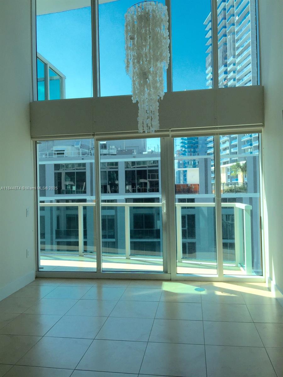 Wonderful 2 story 2 beds/2 baths plus den Condo in heart of Brickell. Unit features two large balconies w/ additional outdoor space. Modern kitchen w/granite counter tops, marble baths and porcelain floors, washer/dryer, tons of closet and storage space. Floor impact windows w/city & river view. Amazing amenities include great pool deck, large gym, security and valet. Walking distance to Metro Mover and Brickell City Center. Great Location!