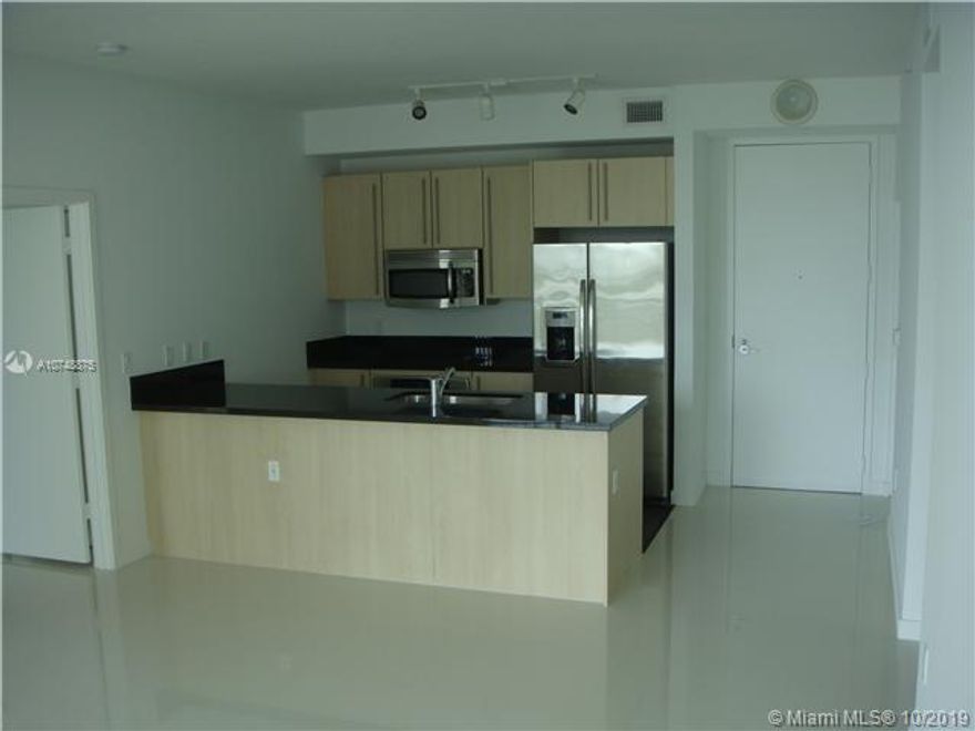 Great Deal for this 2/2 split floor plan unit with porcelain floors ,large balcony accessible from every room.10 feet panoramic glass windows extend from floor to ceiling. The European-style kitchen has stainless steel appliances and Italian cabinetry. Master bathroom has separate bathtub and shower.Two parking spots (tandem) are included and 1 storage.