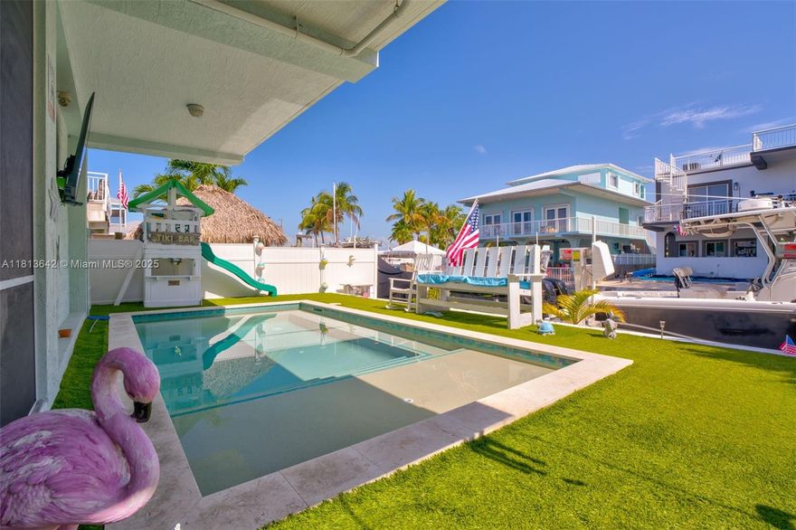 Enjoy stunning bay views and unforgettable sunset skies from the upstairs patio and kitchen, creating the ideal backdrop for everyday living or entertaining. Outdoor features include a heated and chilled saltwater pool, Jacuzzi hot tub, screened-in porch, and a 40' dock with a 10,000 lb boat lift. There's also a garage/workshop, covered parking, and a dedicated RV hookup perfect for guests or toys. Located bayside at Mile Marker 101.5, this 3 bed, 2 bath home features 1,300 Sq Ft of living space on a 3,600 Sq Ft lot.