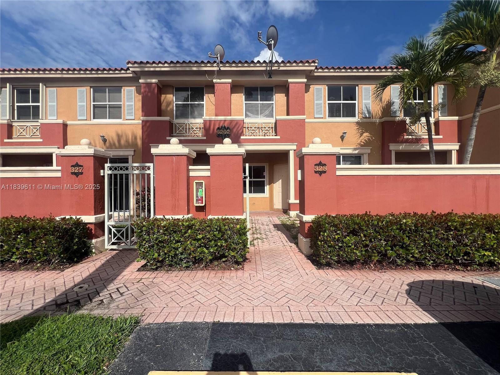 Beautiful townhouse for rent in the gated community The Gates at Doral. This 2-story home offers 2 bedrooms, 2 full bathrooms upstairs, and a half bath downstairs. Bright and spacious layout with social areas on the first floor and bedrooms upstairs for privacy. Tile flooring downstairs, laminate upstairs. Full-size washer and dryer. Private patio, and ready to move in! Community features 24/7 security, pool, playground, and clubhouse. Excellent location near A+ schools, shopping, restaurants, and Turnpike access. Private parking and guest parking in front of the property.