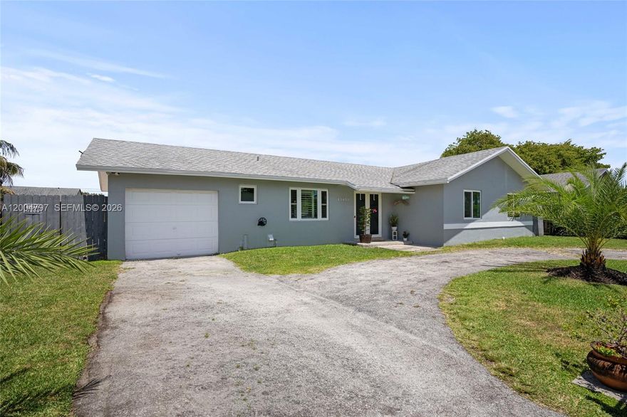 Welcome home to this charming 3-bedroom pool home on an oversized 8,198 sq. ft. lot with NO HOA. Offering both value and versatility, this property features a 2020 roof, impact windows throughout except for the two sliding glass doors, 2 renovated bathrooms, a circular driveway, and a refreshing pool, perfect for enjoying South Florida living. The converted garage efficiency provides immediate income-producing potential, making this home appealing to both homeowners and investors alike. Conveniently located near schools, shopping, dining, and major highways for an easy commute.