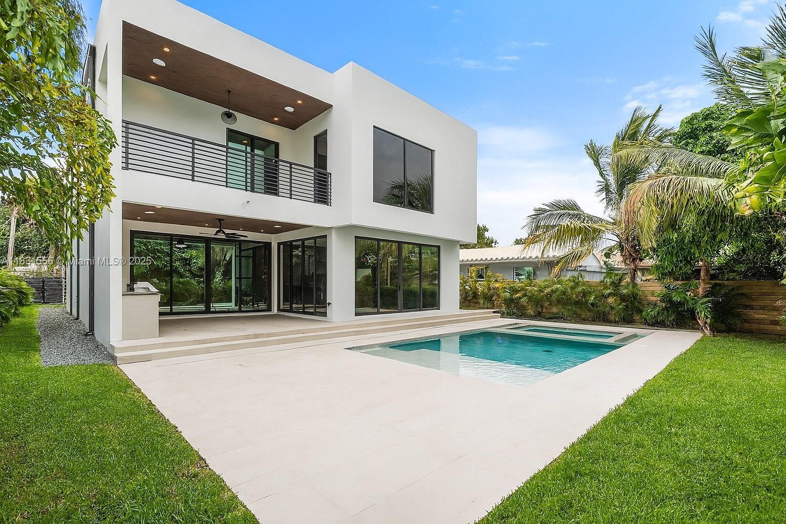 THIS ISN’T JUST ANOTHER NEW CONSTRUCTION—it’s a design-forward lifestyle for the bold, modern, and unapologetically stylish. Located in coveted Victoria Park, mins from Las Olas, the beach & all FTL offers. On a RARE 8,100 SF lot, you're greeted by a 27-ft ceiling and floating oak staircase set against a porcelain-slabbed statement wall—it’s art. The open layout flows into a designer kitchen w/ a 13-ft waterfall island, framed by glass that blurs the line between in & out. Out back: a private resort—heated saltwater pool, spa, summer kitchen & lush landscaping that feels like a permanent vacation. The primary suite is a sanctuary, w/ spa bath, soaking tub, rain shower & curated finishes that whisper luxury. Best part? You’re cruising to dinner, the beach, or your fave café in a golf cart.