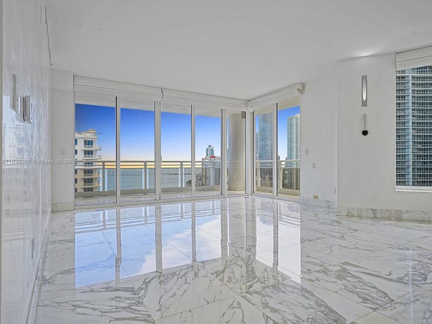 The best and most dramatic line in luxurious Carbonell on exclusive Brickell Key Island. Enjoy island life with 180 degree views from the entire west side of the building which offers open bay and breathtaking city skyline views from this 29th floor unit. Floor to ceiling windows with 2 balconies on each side. Split floor plan offers privacy for every bedroom. Carbonell offers top amenities including 2 tennis courts, golf putting area, indoor racquetball court, indoor basketball court, heated swimming pool great for lap swimming, jacuzzi, BBQ area, private childs playroom, party room, conference room, computer room, 2 story gym with the latest equipment. Brickell Key offers top amenities with a short bridge leading you from private island life to exciting restaurants and nightlife.