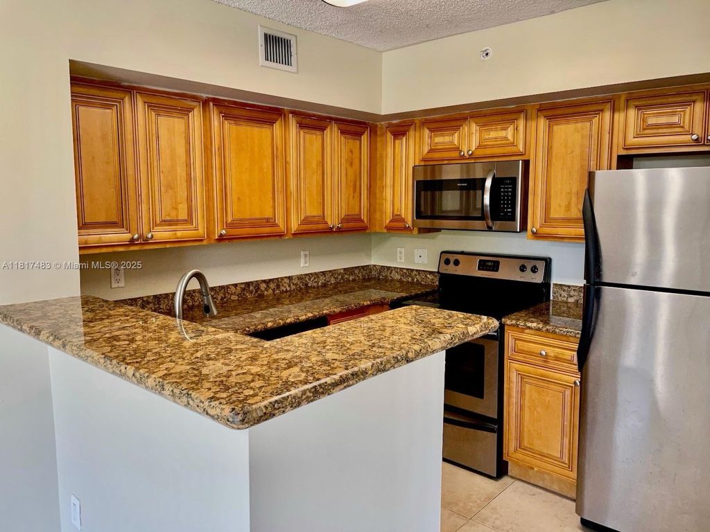 Photo of 12178 Saint Andrews Pl #104, Miramar, FL 33025 (MLS # A11817483)