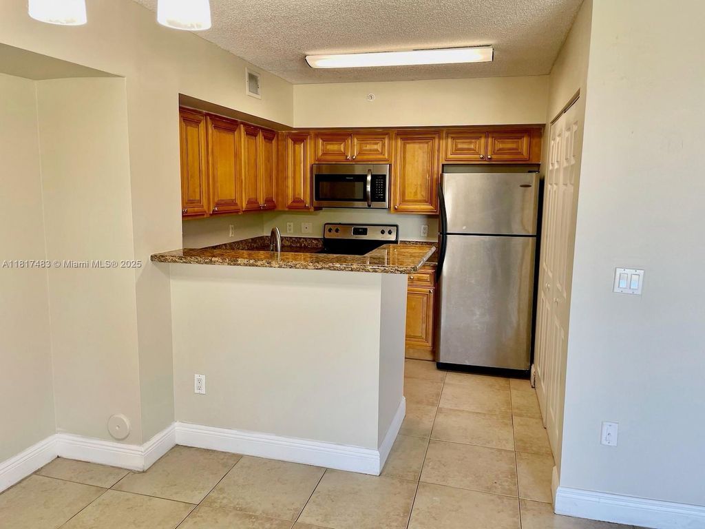 Photo of 12178 Saint Andrews Pl #104, Miramar, FL 33025 (MLS # A11817483)