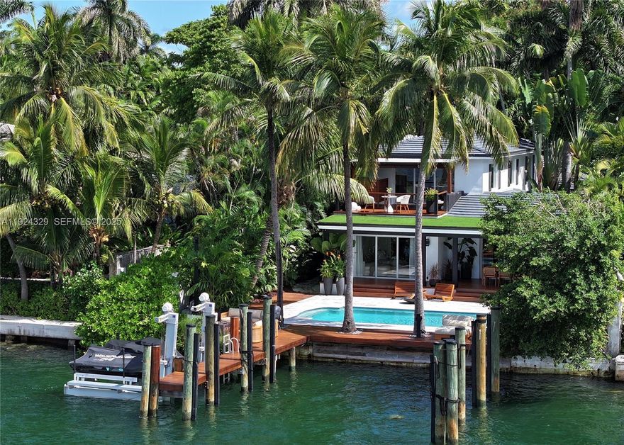 Make it a season to remember with incredible sunsets, wide-open bay views and Miami’s iconic skyline from this beautifully remodeled waterfront home on the Venetian Islands. With dockage for a 75 ft yacht, this 4-bedroom, 4-bath residence blends modern design with warm, inviting charm. Light-filled interiors feature clean lines, custom finishes, and a sleek, updated kitchen and bathrooms. The entire second floor is dedicated to the primary suite, complete with a private terrace, steam shower, and floating tub overlooking the bay. Outdoors, enjoy a spacious pool, outdoor shower, covered lounge, and a new bayfront deck perfect for relaxing or entertaining. A rare rental opportunity offering move-in-ready comfort, exceptional quality, and one of the most desirable views in Miami Beach.