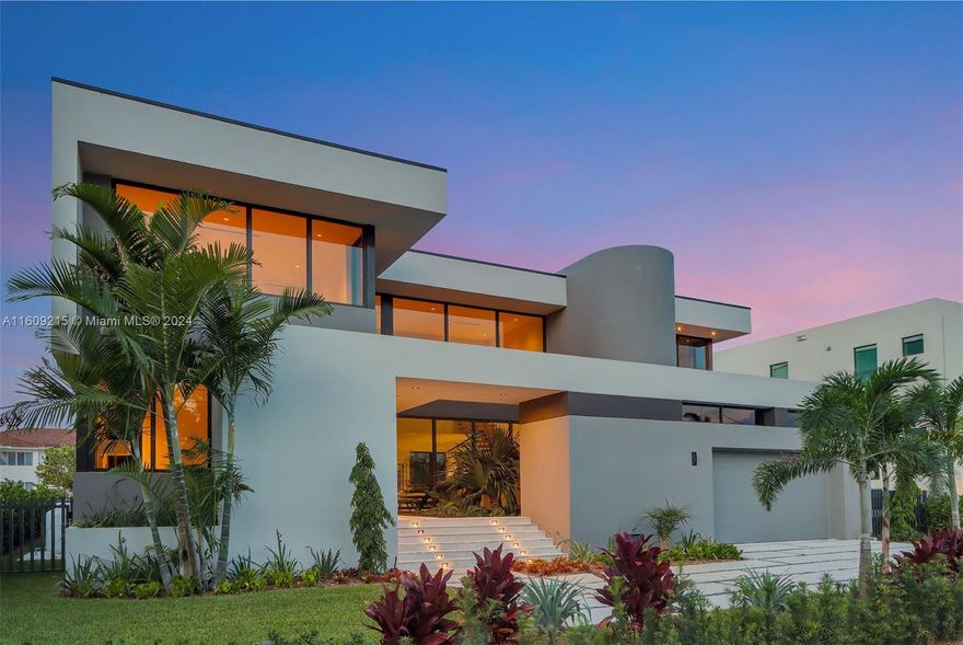 Stunning new modern waterfront home in guard-gated community of Eastern Shores, a boater’s favorite. 5,901 SF of total construction & 4,845 SF under AC featuring 5 bedrooms, 6.5 bathrooms + maids quarters. It offers 80' of water frontage with a new 60' dock & no fixed bridges to the open bay. High-end finishes include custom Italian Veneta Cucine kitchen w/Subzero Wolf appliances, smart home technology & high-end Axor & Duravit plumbing/bath fixtures. Additional amenities comprise a pool, elevator, summer kitchen and a 2 car garage with storage room. Steps away from Sunny Isles Beach, Aventura, dining & Oleta River State Park.