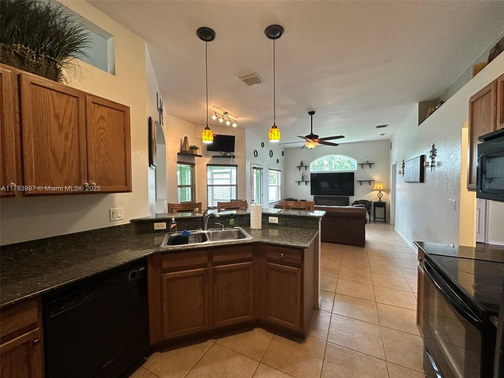 Photo of 1214 SW Patricia Ave, Port St Lucie, FL 34953 (MLS # A11783997)