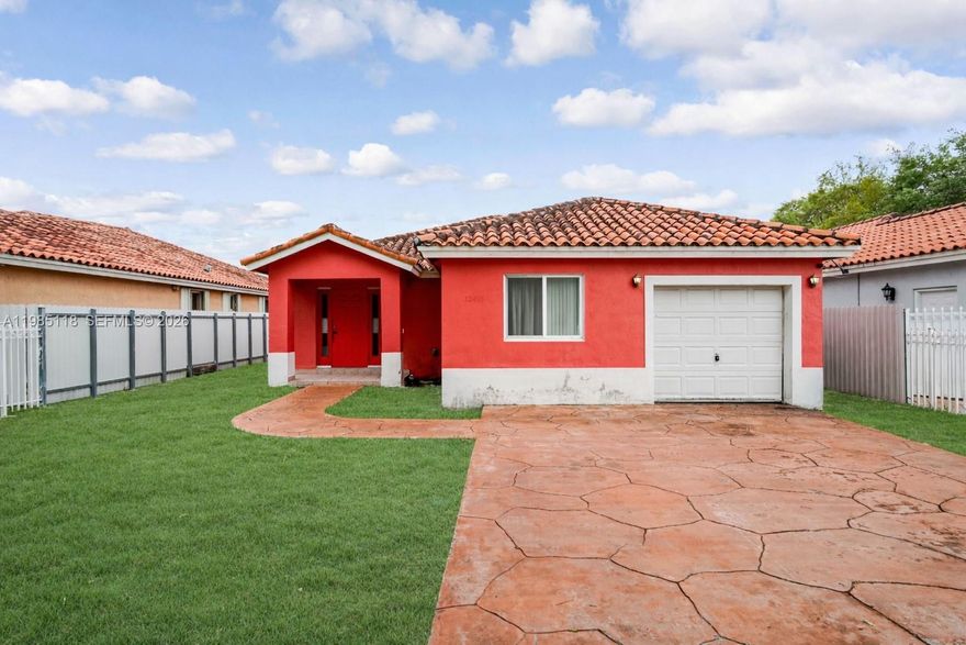 Spacious single-family home featuring 4 bedrooms and 3 bathrooms, offering 2,103 sq ft of comfortable living space. This home includes a 1 car garage, tile floors throughout, and a convenient in-unit washer and dryer. The open kitchen is equipped with a refrigerator and electric stove, perfect for everyday living and entertaining.

Enjoy a large fenced backyard with plenty of room to add a pool, ideal for outdoor gatherings. The primary suite features a walk-in closet, providing ample storage. A great opportunity for buyers seeking space, functionality, and potential.