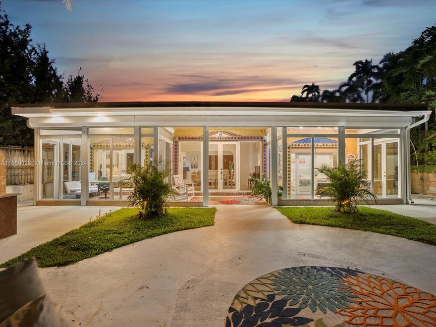 Exquisite waterfront residence in Biscayne Point. Distinctive home featuring 5 bedrooms, 4 bathrooms, including a separate efficiency unit. Total area is 2,444 sqft. Recently remodeled with a new flat roof. Updated features with two new bathrooms. Designed by renowned artist Ian Cohen. The kosher kitchen, highlighted in home design magazine, showcases bamboo cabinets. The living room includes a ceiling retractable projector/screen and sound system. Two flexible spaces used as offices facing the canal, perfect as home office. The tropical backyard offers ocean access and dockage boat davits. Outdoor kitchen with brick pizza oven and large grill to entertain family and friends. Bring your boat, jet skis & relax! This is the only 5DR, 4BA home in Biscayne Point at $1,178/sqft. Don't miss it!