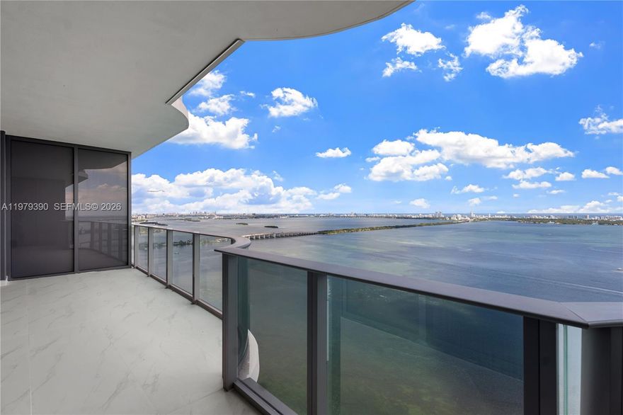 Waterfront living in this brand-new 1,838 sqft residence featuring a private foyer, 2 bedrooms plus a den. This home includes two assigned garage parking spaces conveniently located between the third and fourth floors. Floor-to-ceiling 10-ft impact glass windows frame breathtaking direct Biscayne Bay and ocean views. Aria Reserve offers an unparalleled lifestyle with resort-style amenities: a semi-Olympic pool, state-of-the-art fitness center, wine lounge, party room, tennis & paddle courts, mini-golf, kids’ play area, cabanas, business center, and a secured lobby. Perfectly situated in Miami’s vibrant Edgewater neighborhood, you’re just minutes from Wynwood, the Design District, and Miami Beach.
