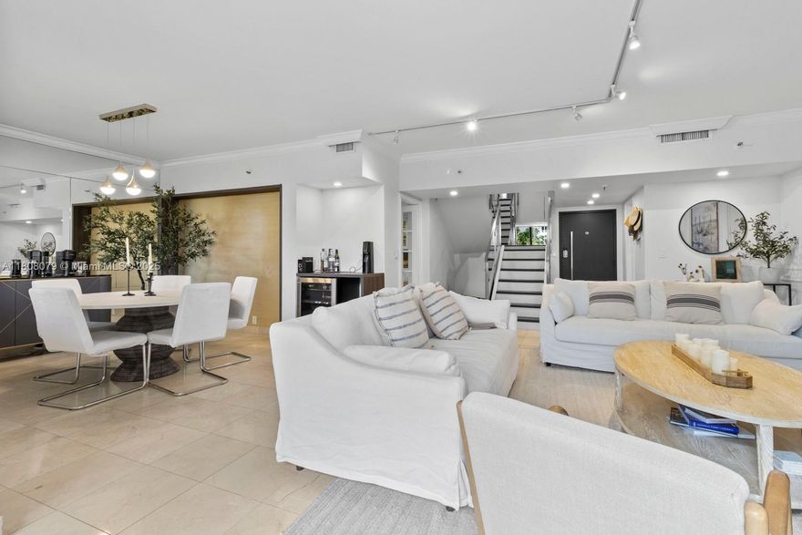 Experience townhouse style living in the heart of Brickell Key, with direct access to the pool and amenities. Enter conveniently through the lobby to this unique two-story lanai unit. This spectacular and bright property offers the perfect blend of space and functionality, featuring 2 BED + DEN and 2.5 BATHS. The first floor includes a spacious living and dining area, kitchen, and private lanai access. Upstairs, you’ll find bright bedrooms, a den, and renovated bathrooms. A/C STORAGE included. Enjoy full-service amenities: 24-hour security, valet parking, pool, tennis courts, gym, billiard room, steam/sauna rooms, racquetball court, party room, and kids' playroom. Live the exclusive island lifestyle with fine dining, a gourmet market, a children's park, and waterfront walking paths.