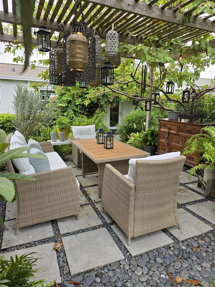 Remodeled home 5 yrs ago with a lush landscaping patio with exotic fruit trees and a romantic vibe. Great area to entertain family and friends. The layout has been updated, featuring a new roof, a remodeled bathroom, impact windows, upgraded electrical systems, new air conditioning, a tankless water heater, sprinklers, a stock tank pool, and an outside shower. The circular driveway allows parking for several cars. Enjoy the sound of the water fountains throughout the home. Close to the beach, Las Olas Blvd, Wilton Manors, shopping, and entertainment. Excluded the dining room lamp and TV wall panel.