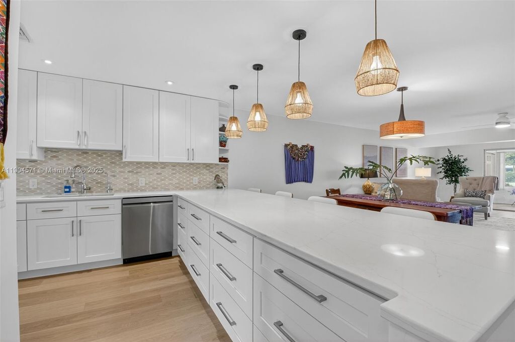 Photo of 1520 NW 19th Ter #102, Delray Beach, FL 33445 (MLS # A11904571)