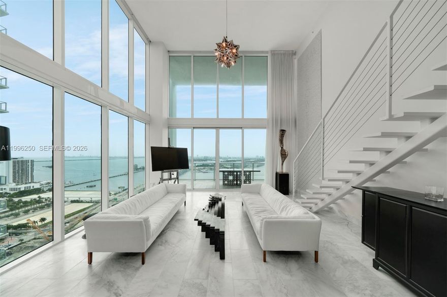 Available May 1st. A beautifully furnished 2-story loft at Ten Museum Park with 2 Bedrooms, 2.5 Baths, 1,730 interior square feet, Carrera white marble flooring throughout, renovated bathrooms, stainless steel kitchen appliances, and 20-foot-high ceilings overlooking the park and Biscayne Bay. 2 parking spaces included. Building amenities include swimming pools, hot tub, fitness center, spa, 24-hour valet parking service, and 24-hour concierge. No pets.
