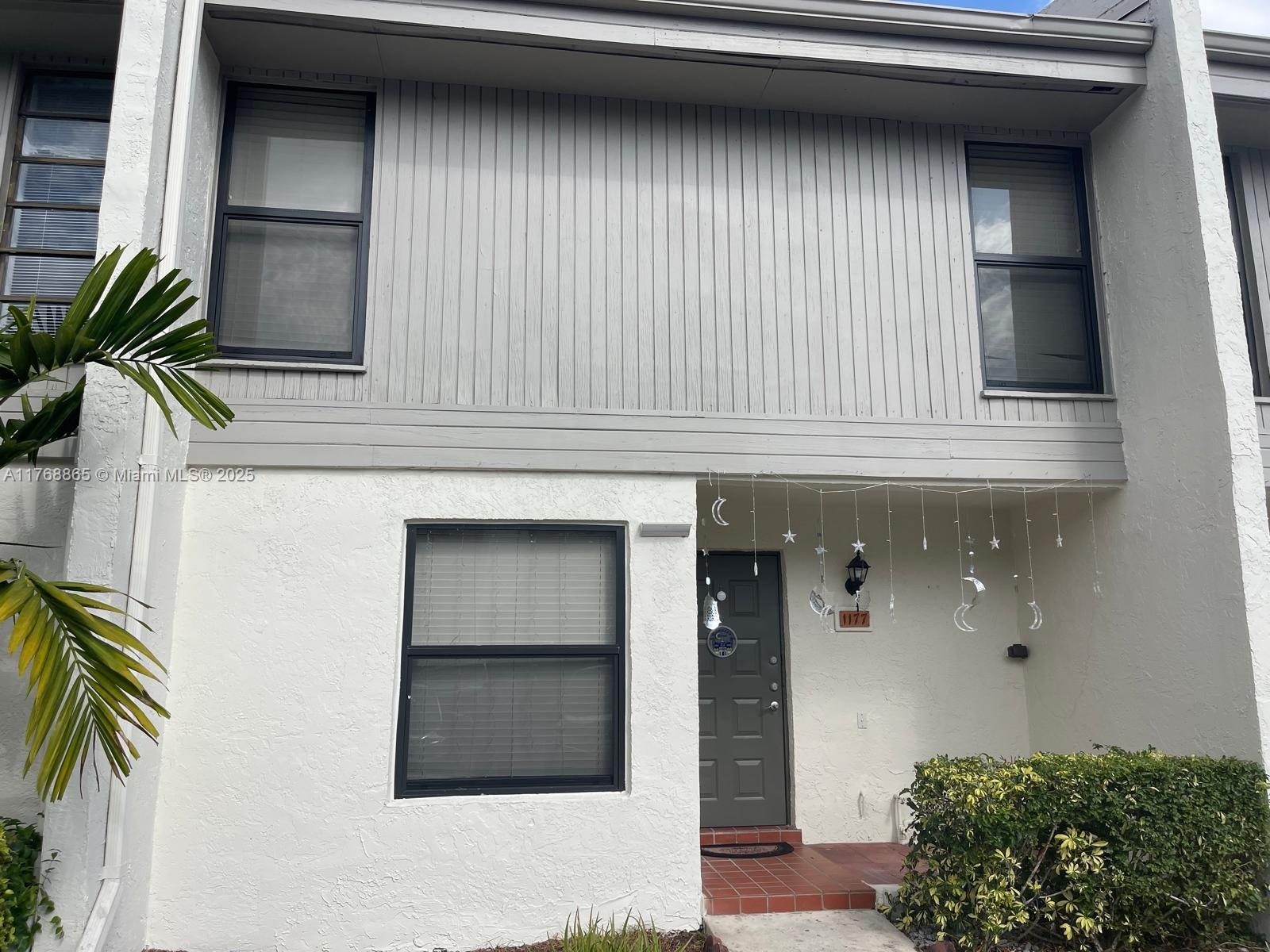 Spacious 3-bedroom, 2.5-bath townhouse with stunning lake views in the heart of Pembroke Pines. Featuring a screened patio with bar area, sink, and refrigerator hookup—perfect for entertaining. Tile flooring on the first level, wood floors on the stairs and upper bedrooms. The large master suite offers ample closet space. Full-size washer/dryer, impact windows and doors, and two assigned parking spaces. Community amenities include a pool, handball court, and roaming security. Conveniently located near shops, dining, hospitals, and more. No leasing for the first 2 years.