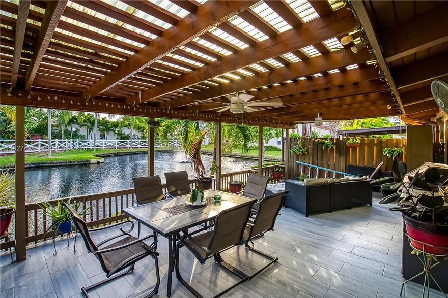 Absolutely gorgeous 1 story townhouse on the water! Waterfront villa in Harbourwood Villas, Three Islands. Spacious and well-maintained 2 bedrooms /2 bathrooms with 1,680 SF of living area on a 2,125 SF lot. Family room may be converted to a potential third bedroom. Stunning Water view from the patio! tranquil pond views and partial marina views from this desirable corner Townhouse! Features include a remodeled kitchen with window, stainless steel appliances, new A/C, high vaulted wood-beam ceilings, impact windows and doors, tile flooring throughout, new water heater, 4 skylights, and 2 walk-in closets. Large paved and covered rear patio ideal for entertaining, plus a welcoming front porch. Two assigned parking spaces directly in front of the unit. Community amenities include pool, tennis courts, racquetball, sauna, and walking paths. Excellent location within walking distance to shops, restaurants, and the beach. Minutes to Gulfstream Park and close to two international airports.