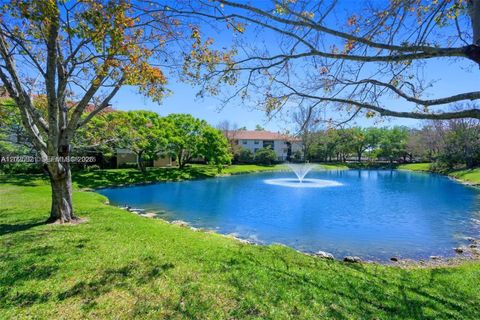 Photo of 10161 W Sunrise Blvd #304, Plantation, FL 33322 (MLS # A12025821)