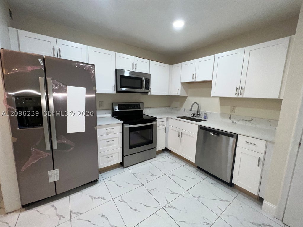 Photo of 2061 NW 47th Ter #207, Lauderhill, FL 33313 (MLS # A12096239)