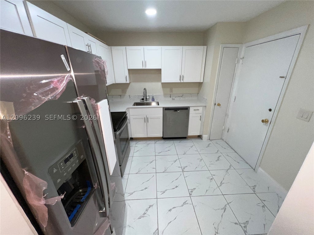 Photo of 2061 NW 47th Ter #207, Lauderhill, FL 33313 (MLS # A12096239)