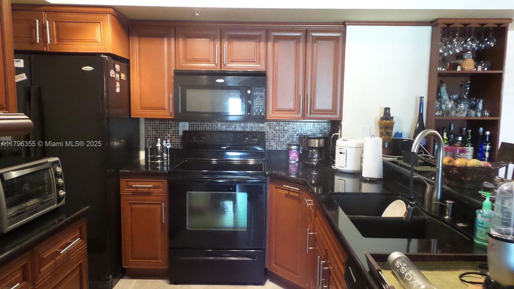 Photo of 2600 S University Dr #212, Davie, FL 33328 (MLS # A11796355)