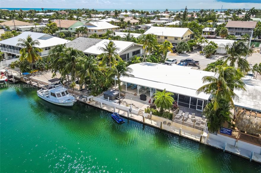 Turnkey, fully furnished waterfront property with strong Airbnb income history. Enjoy 37.5 ft of dockage with unrestricted ocean access and a quick 5-minute ride to the Gulf and ocean side. Home sits above flood, helping reduce insurance and overhead. Features include a 2017 roof and a new water heater (2025). A rare opportunity for investors or buyers seeking effortless coastal living.