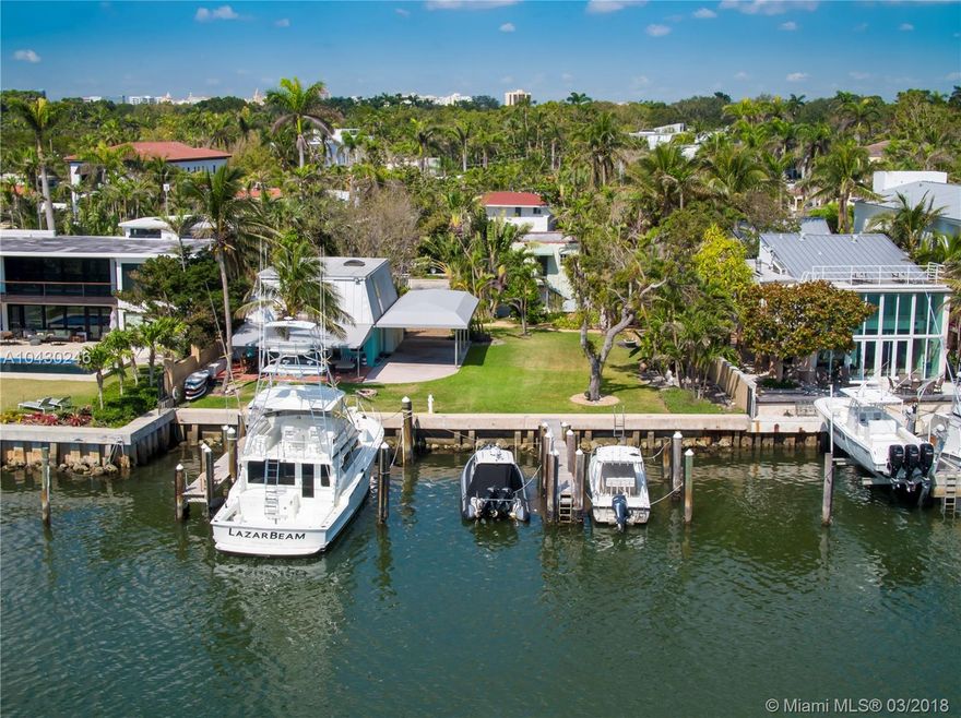 BEST WIDE BAY OPPORTUNITY WITH MULTIPLE SLIPS! 2 UNIFIED SINGLE FAMILY LOTS. INCREDIBLE & RARE COCONUT GROVE 14,000 SF UNOBSTRUCTED WATERFRONT WITH 100 FEET OF NEW SEA WALL COMES TO MARKET TO FULFILL THE DICERNING BOATER’S DREAMS OF CRUISING OR SAILING THE BEAUTIFUL WARM WATERS OF BISCAYNE BAY AND THE ATLANTIC OCEAN. THREE DEEP WATER, LEGAL SLIPS, AND ROOM FOR MORE, DRAFTS OF ABOUT 8 FEET. A 52 FOOTER WAS PARKED THERE, BUT LIKELY A LARGER CRAFT COULD AS WELL. ON THE PROPERTY IS A 3/2 1967 NICELY MAINTAINED AND COMFORTABLE BEACH HOUSE PLUS A SEPERATE 2 CAR GARAGE WITH A SAUNA AND 1/1 APARTMENT ABOVE. STREET TRAVELED MAINLY BY RESIDENTS. OVERNIGHT ROAMING POLICE. JUST MINUTES TO DOWNTOWN, MIAMI BEACH, THE VILLAGE AND MIA