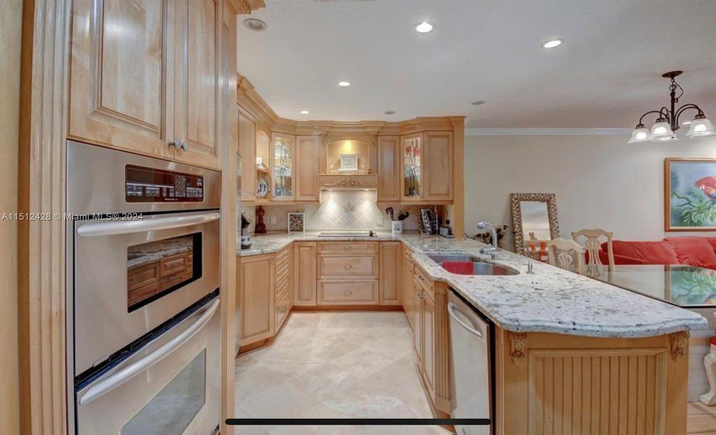 Photo of 2379 Treasure Isle Dr #25, Palm Beach Gardens, FL 33410 (MLS # A11512428)