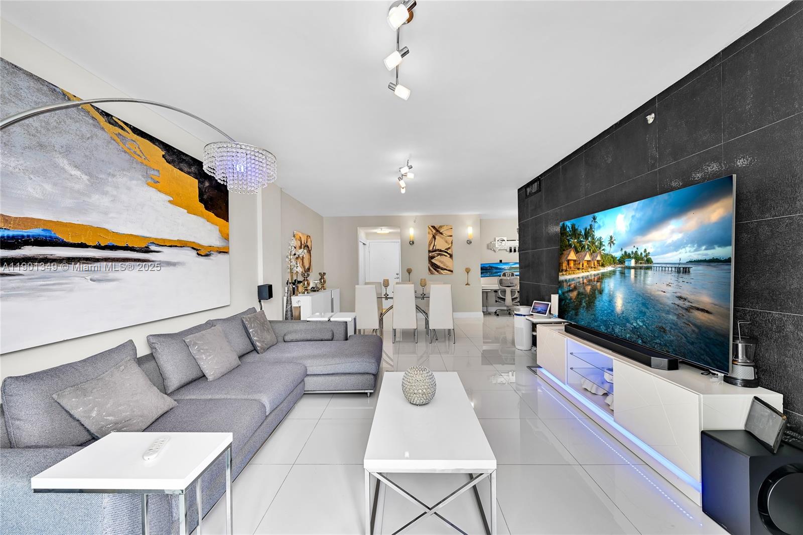 Experience oceanfront resort-style living at its finest! This stunning, fully remodeled residence offers breathtaking ocean views from every room. Featuring elegant glass tile floors, a sleek modern kitchen with premium finishes, and beautifully renovated bathrooms with contemporary design. Custom lighting adds warmth and sophistication throughout. Enjoy world-class amenities including a state-of-the-art fitness center, heated oceanfront pool, cabanas, BBQ area, clubroom,outdoor rocky tropical waterfall jacuzzi, and business center. Ideally located on Hollywood Beach — minutes from fine dining, shopping, and the vibrant Broadwalk. Move-in ready and perfect for those seeking the ultimate coastal lifestyle. furnished negotiable!