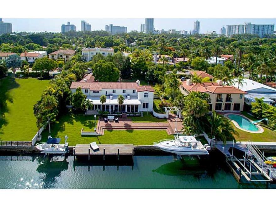 Rare opportunity to own a one of a kind estate on a 24,064SF double lot with 128' on the water. This jewel of Miami Beach totals 4,964SF and was designed by famed architect Russell Pancoast. No detail was overlooked during the recent renovation featuring a new gourmet kitchen, dining room, living room and library featuring designer finishes & elevator. All new impact glass windows & doors. Massive yard with mature tropical landscaping. Large boat dock with 16k lift. Great neighborhood & schools.
