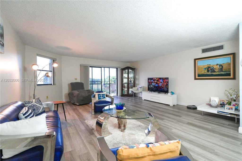 Photo of 16051 Blatt Blvd #401, Weston, FL 33326 (MLS # A12032006)