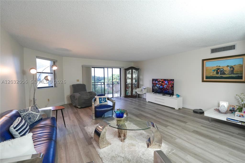 Photo of 16051 Blatt Blvd #401, Weston, FL 33326 (MLS # A12032006)