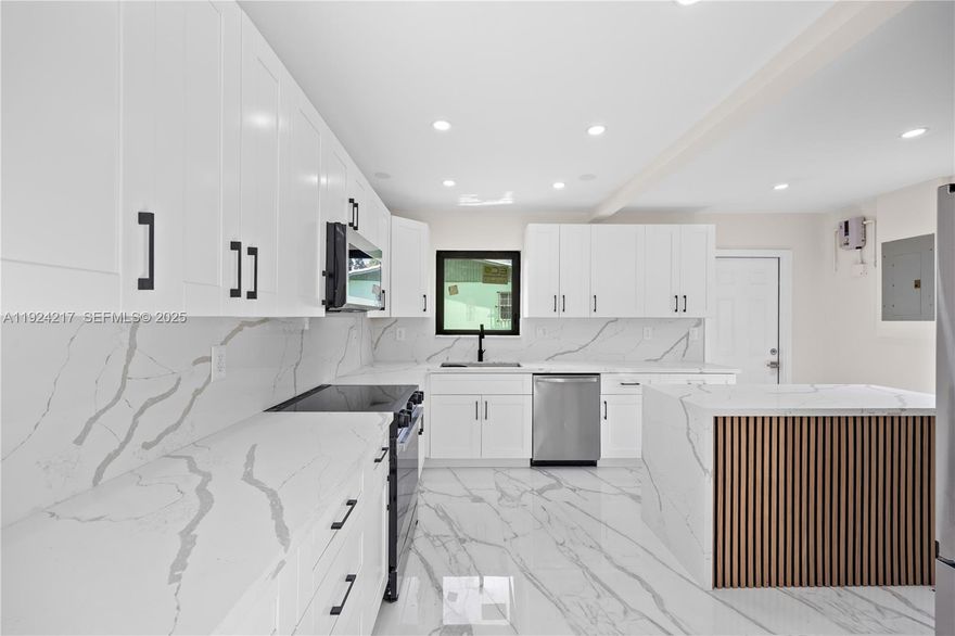 Renovated 3/2 w/ open kitchen with shaker cabinets, callacata counters & island, New stainless appliances, and Brand new W&D. Stylish updated baths. Brand NEW 3 dimensional Shingle roof, and Brand NEW Eco windows Impact windows!! Smart entry lock w/ camera ring. Remote motor powered car gate! BIG backyard! MUST SEE