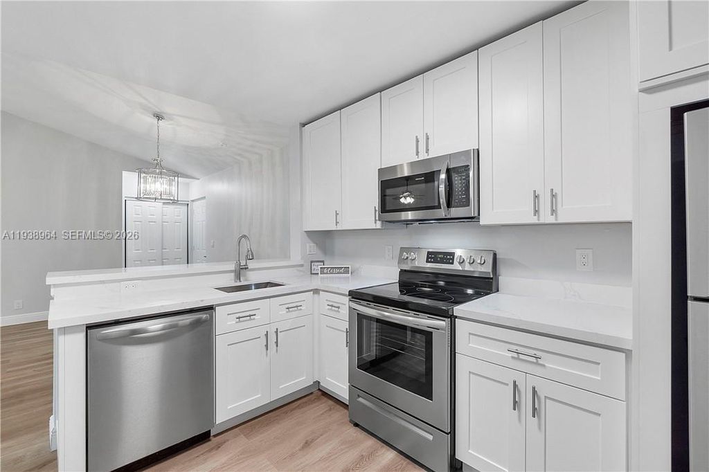 Photo of 5861 Riverside Dr #205A2, Coral Springs, FL 33067 (MLS # A11938964)