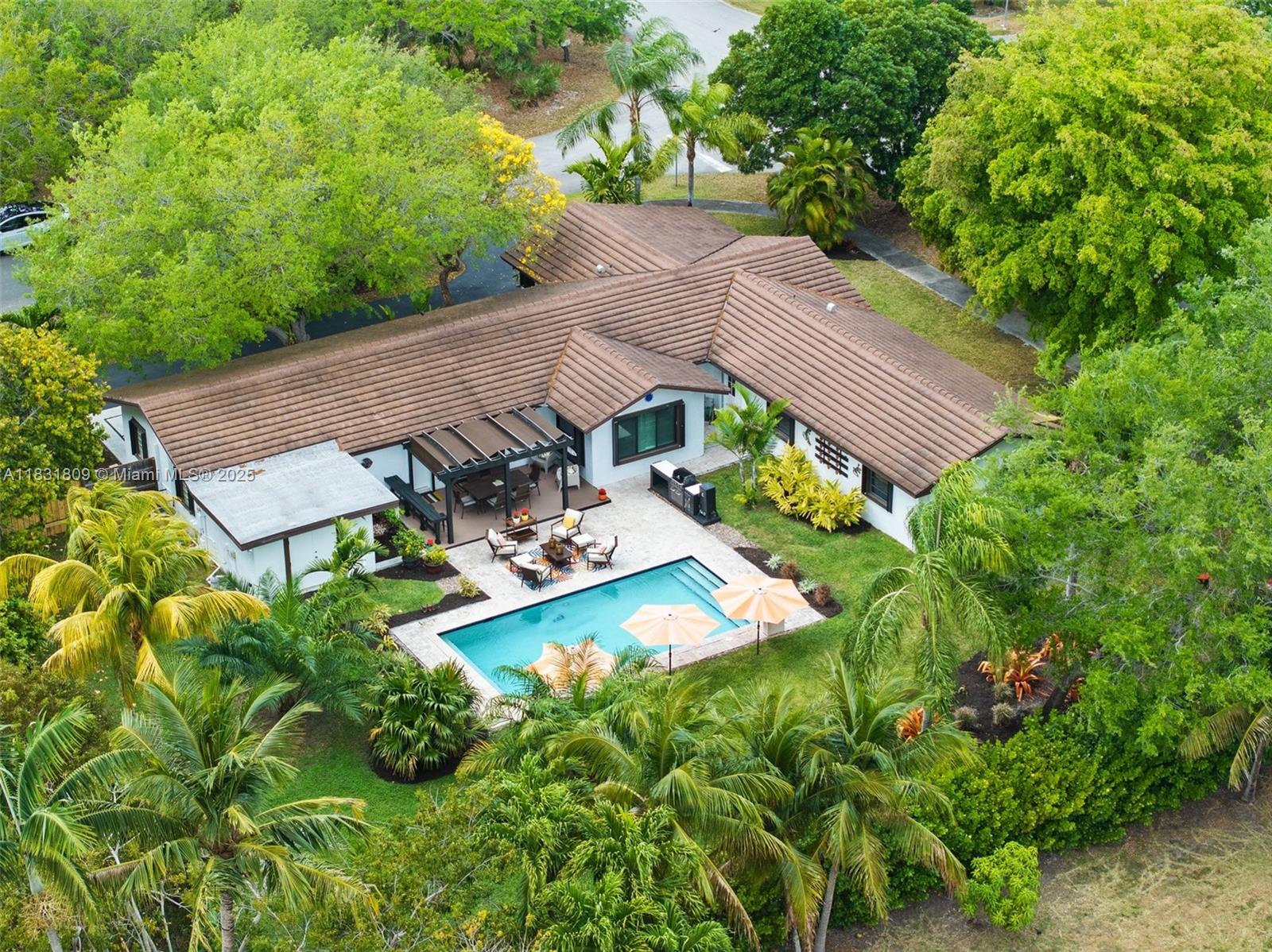 Extensively Updated Palmetto Bay Home. Warm & inviting, this single-story corner lot residence delivers the
classic South Fla. lifestyle in one of Miami’s most rapidly trending neighborhoods. The curb appeal is beautiful,
w/fresh paint & artfully designed, lighted crisp tropical landscaping. Backyard privacy is complete, via a dense,
high hedge & fencing. Within that outdoor sanctuary, the soft grass, swimming pool, grill, open-air & pergolacovered terraces set the scene for a lifetime of play, parties, BBQs & blissful downtime. The chic, comforting interior offers a layout of distinct rooms w/gleaming porcelain tiles, wood-look bedroom floors & open, flowthrough connectivity. Favorite features incl. remodeled kitchen & baths plus a spacious den. Impact windows + impact garage door.