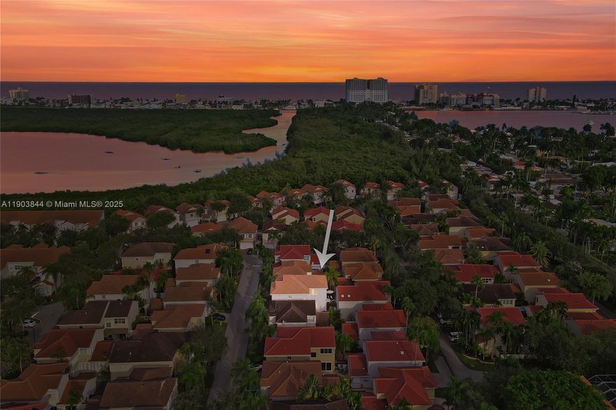 RARE OPPORTUNITY!!! Stunning two-story home in the exclusive West Lake Village! 3 beds, 2.5 baths + office with 2,270 sq. ft. of living space. Bright and open layout with 20-ft ceilings, large windows, tile floors downstairs, and wood floors upstairs. Modern kitchen with island, granite countertops, backsplash, and stainless steel appliances. Ground-floor primary suite plus guest half bath. Laundry in garage, two-car garage, and paved backyard ideal for entertaining. Resort-style gated community with 24-hour security, pool, gym, tennis, basketball, and playground. Prime location less than 10 minutes to Hollywood Beach Broadwalk! Low HOA $360/month.