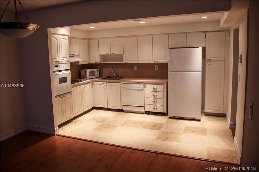 Highly desirable 1/1.5 remodeled unit in OceanView A at an unbeatable price! Open floor plan! Updated kitchen with beautiful marble floors and wood laminate floors, 2 walk in closets in bedroom, and spacious east facing balcony! Plenty of natural light! Building has great amenities: 24hr security, pool on the Intracoastal, state of the art gym, tennis, BBQ/picnic area, business room, 24hr valet parking, ect. 1 Covered parking included. Walk to the beach and in the middle of all great shopping. A MUST SEE!