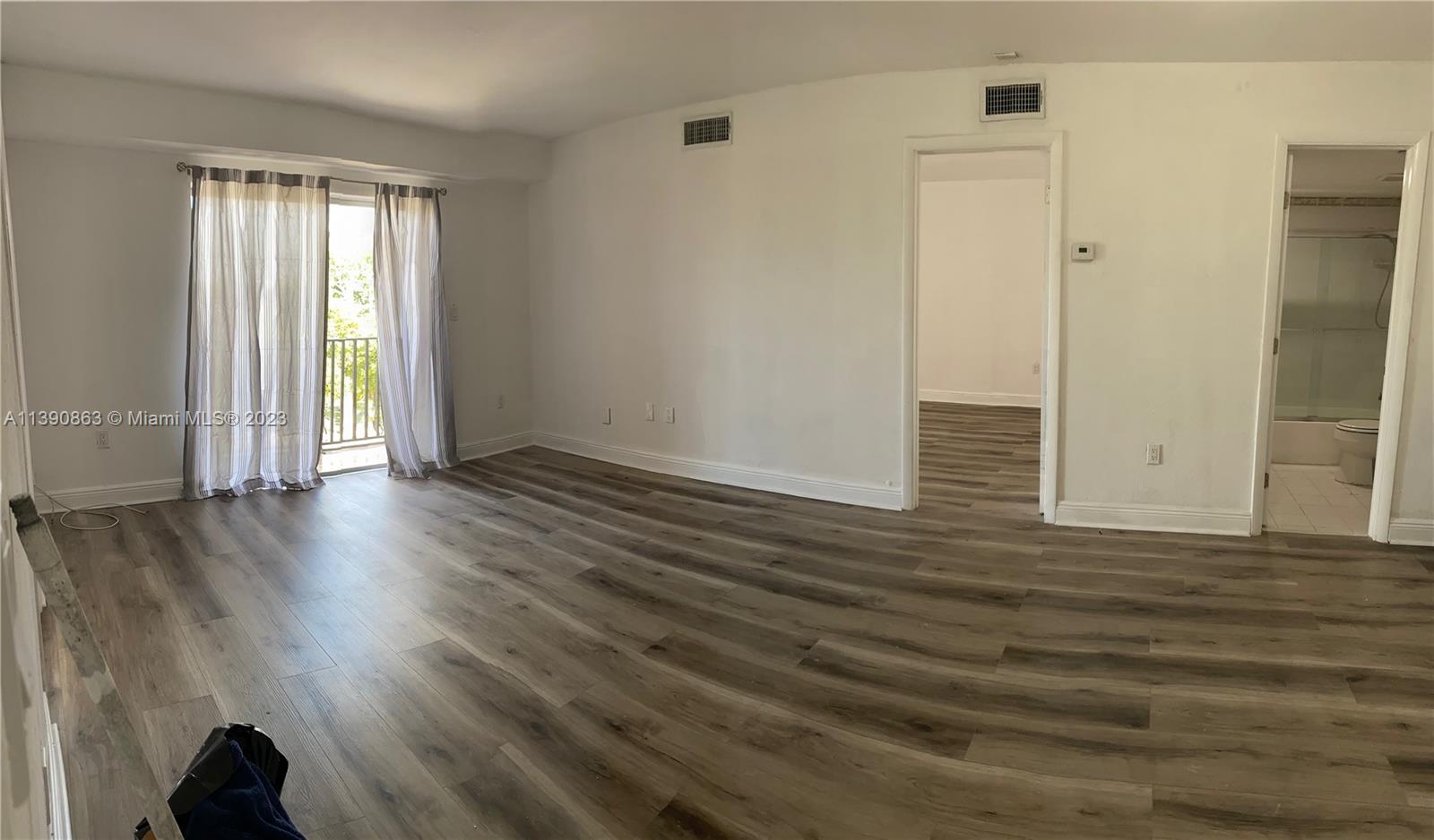 Location! Location! AND totally renovated apartment, new wood like floors. Beautiful bathroom with vanity and glass doors.freshly painted Unobstructed view to tree lined street. Guarded and closed community .