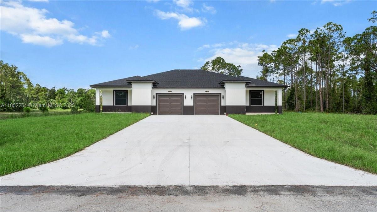 HAF ACRES LOT Brand new duplex . Each side offers 3 bedrooms , 2 full bathrooms, and a 1-car garage, providing a total of 2,400 square feet of modern living space. With modern tile flooring throughout, sleek white shaker cabinets, quartz countertops, and SAMSUNG stainless-steel appliances, this property is move-in ready and low maintenance. Whether you're an investor looking for a high-performing rental or a homeowner wanting to live in one side while renting out the other, this opportunity checks all the boxes. Both garages feature epoxy-coated floors. Don't miss this chance to own a brand-new income-producing property!15K CONTRIBUTION TO BUYERS CLOSING COST.