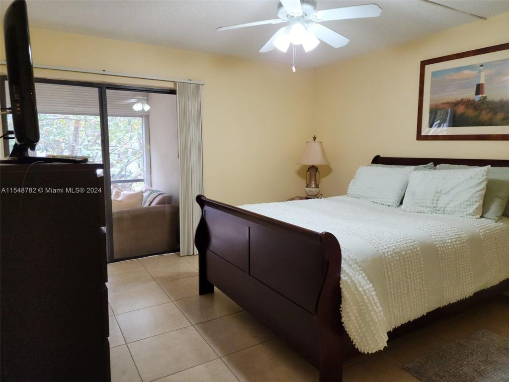 Photo of 2302 S Cypress Bend Dr #207, Pompano Beach, FL 33069 (MLS # A11548782)