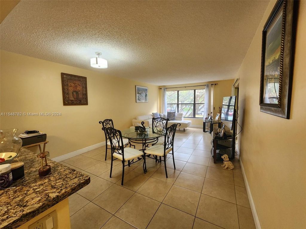 Photo of 2302 S Cypress Bend Dr #207, Pompano Beach, FL 33069 (MLS # A11548782)
